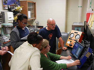 High School Teachers looking at a computer display