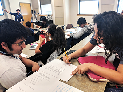 two students helping each other