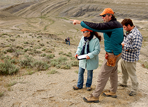 Instructor and students in the field