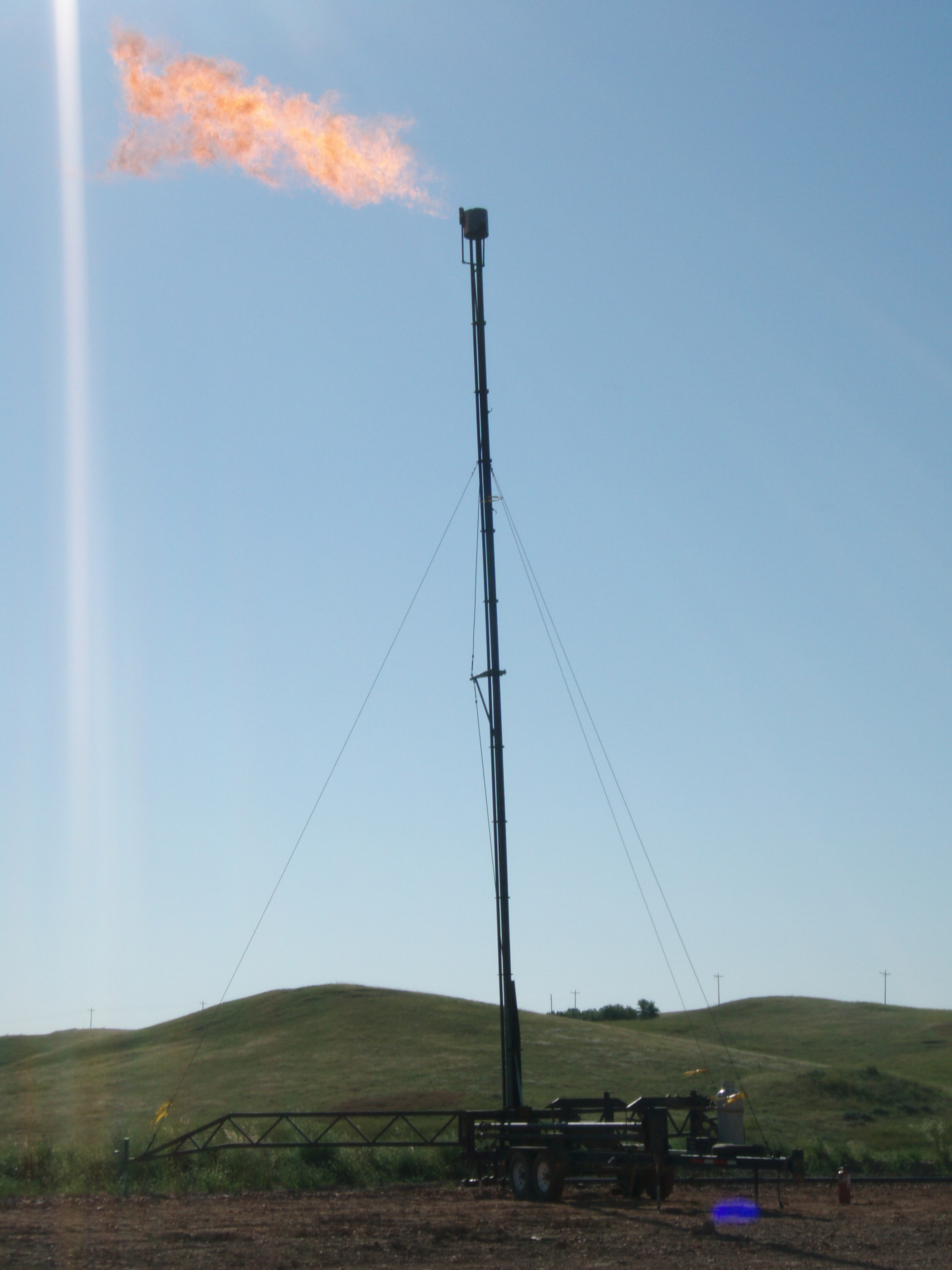 Uncaptured natural gas being flared off in the Bakken oil field, converting the methane to carbon dioxide.
