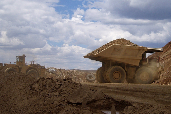 Mine trucks moving material from the Cripple Creek and Victor Gold Mines in Colorado. Image Credit USGS/Photo by Yolanda Fong-Sam