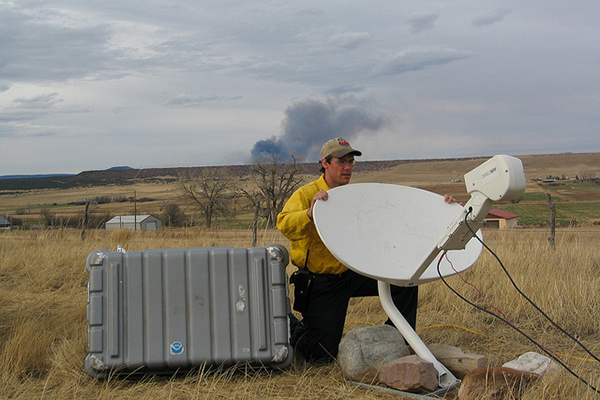 A meteorologist setting up equipment