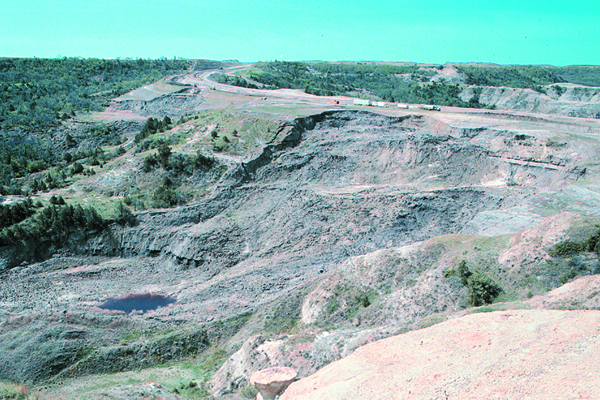 Fig. 1. Two recent landslides impacting ND Highway 22 along the south edge of the Little Missouri River Valley. It cost $2 million to stabilize the area and realign the road. Credit: E. Murphy