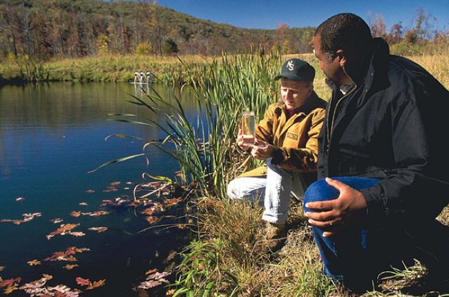 Survey of water quality in a mine water filtration pond. Image Credit: Ron Nichols, USDA NRCS