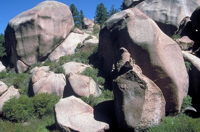 Spheroid weathering of granite. Spheroidal weathering is a form of chemical weathering. This occurs when concentric shells of decayed rock are successively loosened and separated from a block of rock by water.