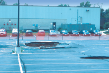 Fig. 1. Sinkholes in collapsed parking area, Frederick, MD. Sinkholes form in carbonate areas as the dissolving and weakening of bedrock cause it to collapse. Credit: D.K. Brezinksi