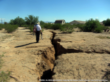 An AZGS geoscientist studies the Queen Creek Earth Fissures