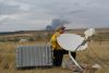 National Weather Service IMET Brent Wachter aiming/positioning the Direcway satellite dish. 