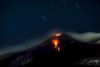 Italy's Mount Etna erupting, with glowing lava at the summit. 