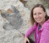 IAGD IGER Award Winner Jessica Smay next to an iguanadon dinosaur footprint at last year's Accessible Geology Field Trip. 
