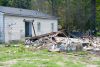 The aftermath of flooding is seen at a home that was damaged when flooded creeks swept water through Flat Top, Kentucky. Photo by Patsy Lynch/FEMA