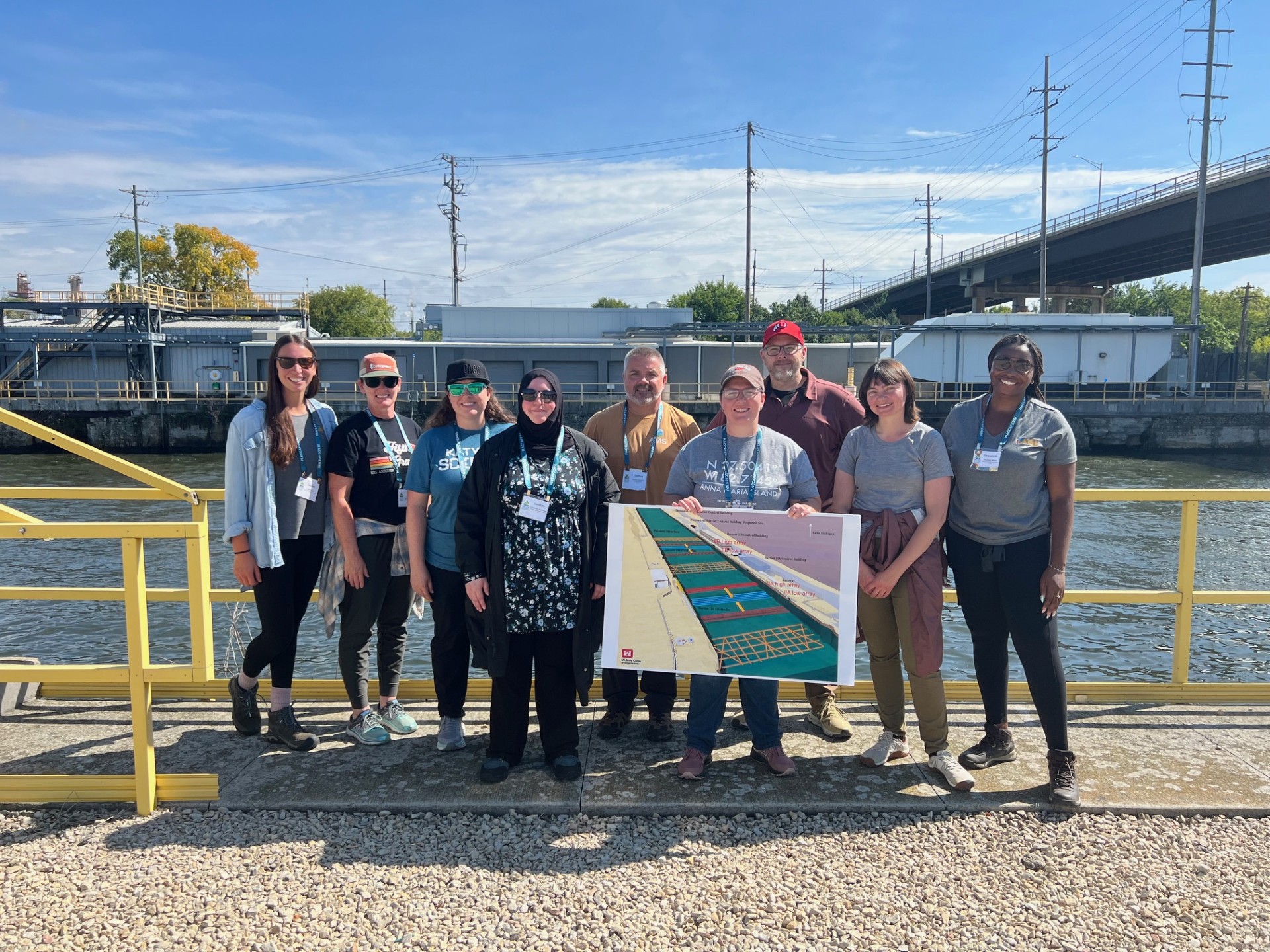 AEG Group Photo 2 Teachers and workshop leaders at a field stop in front of a river.