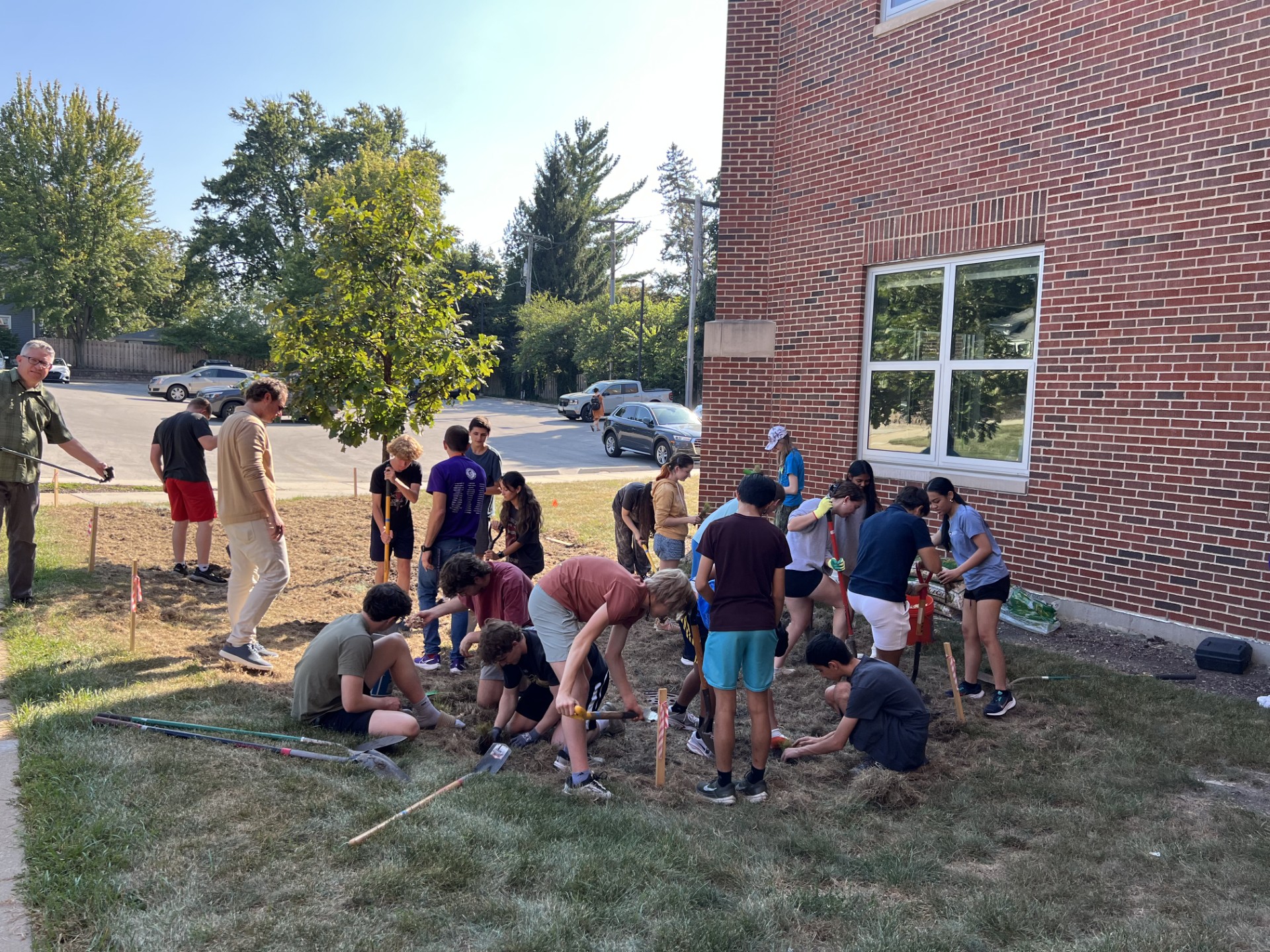 Students installing a rain garden at a high school.