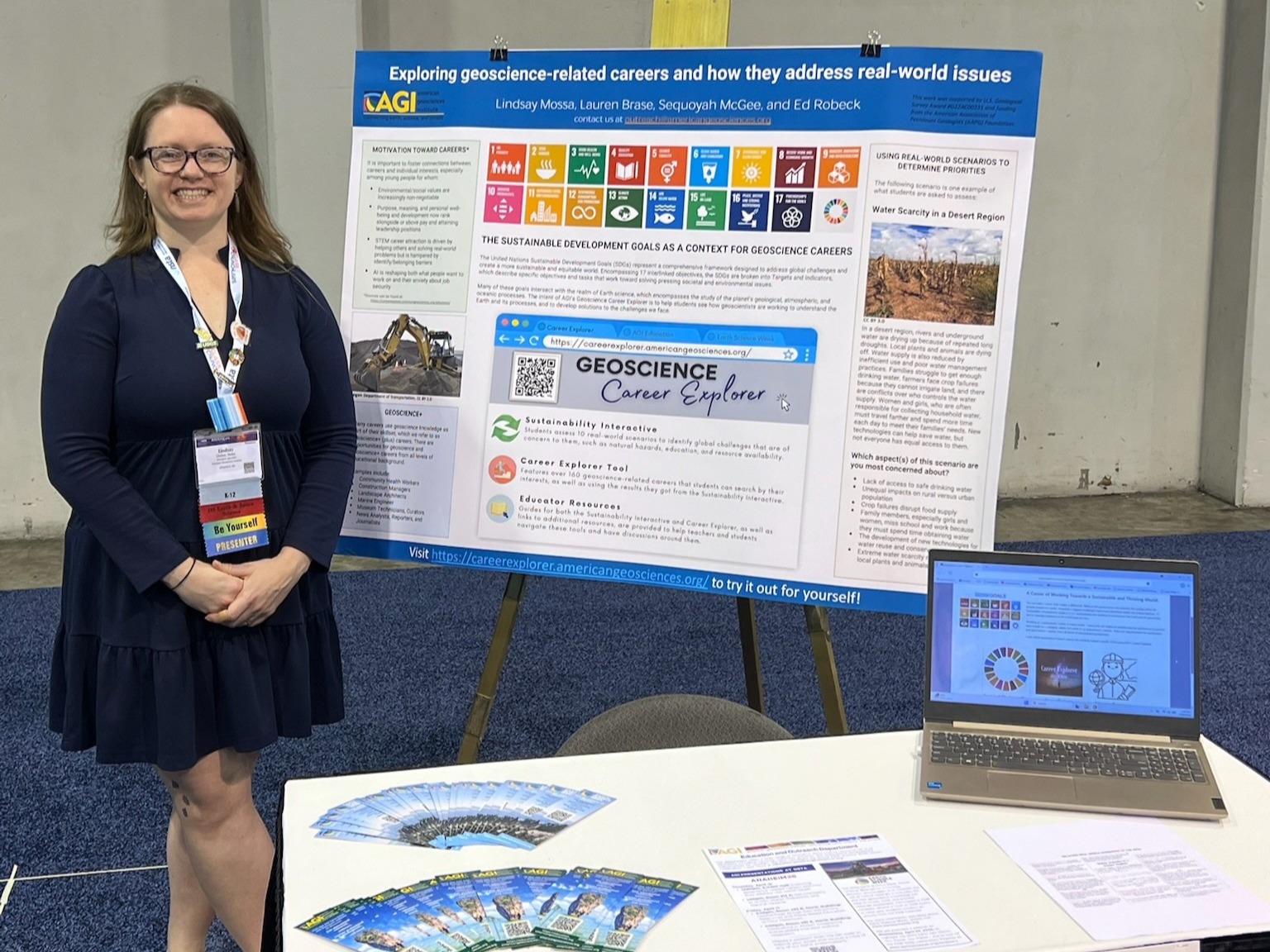 AGI Education Specialist standing in front of a poster she presented on careers