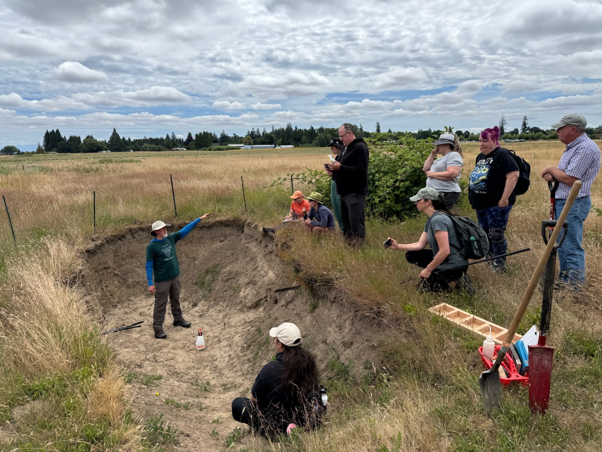 SSW picture 2 SSW participants looking into a soil pit