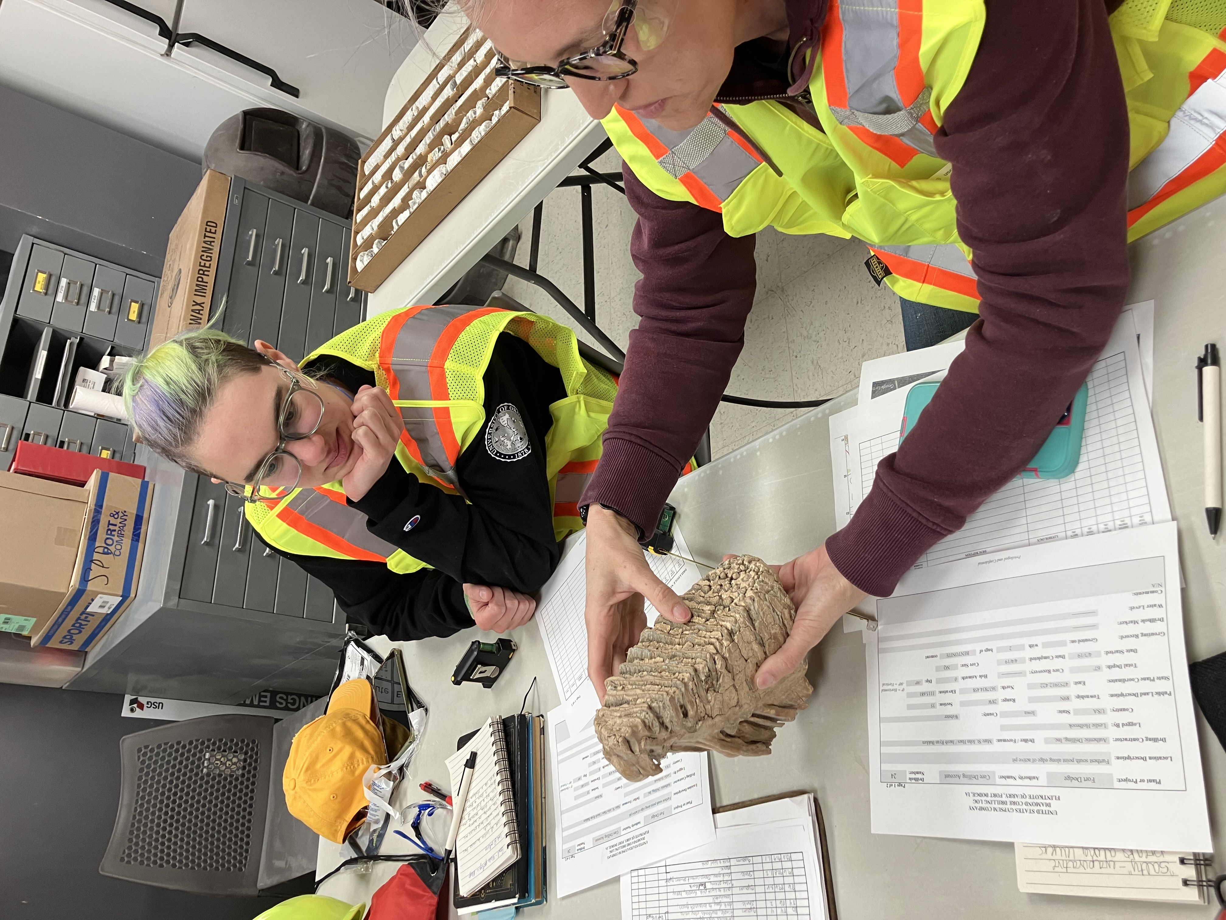 Gypsum sample two people looking at a gypsum sample
