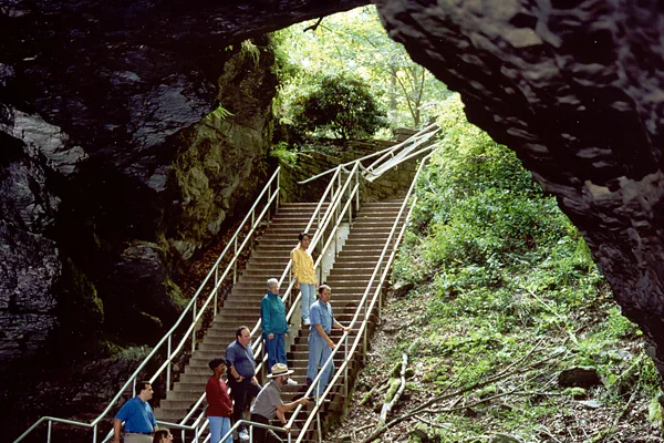 Figure 1: A National Park Service ranger leads visitors into the mouth of Mammoth Cave National Park, Kentucky. Credit: National Park Service