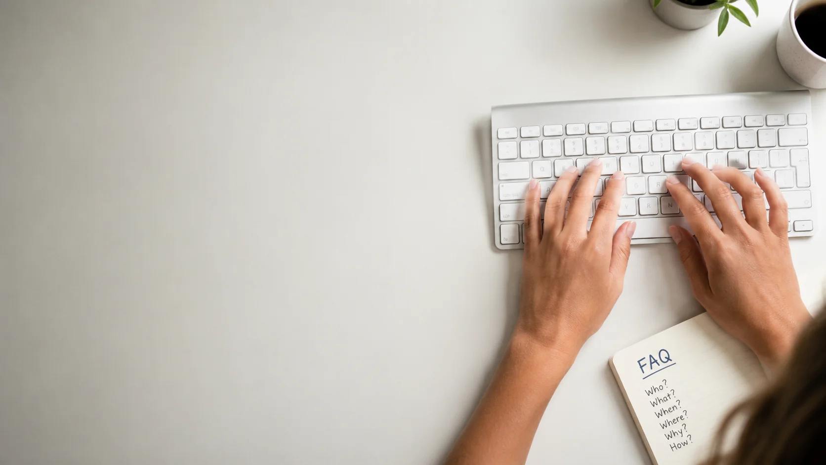 Person typing on a keyboard.