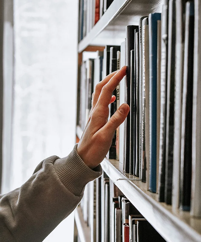 Browsing a bookshelf of documents.