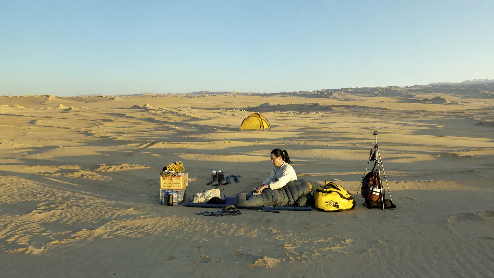 Geoscientist doing fieldwork in the desert.